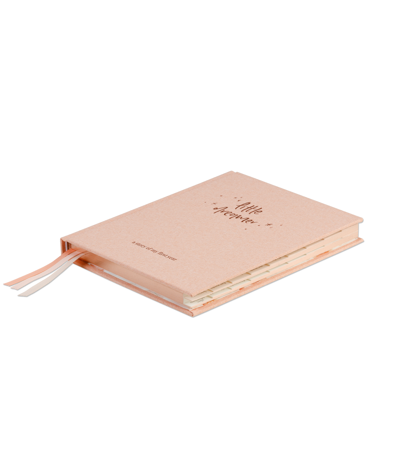 A side view of the Emma Kate Co. little dreamer baby journal in petal on a transparent surface.