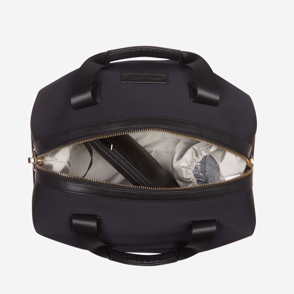 A sleek and compact every-day version of our best selling RAF WEEKENDER. Smaller but perfectly formed and includes all original internal functionality.   This hard-working holdall gets a sports-lux make-over in sleek Black scuba fabric, paired with lux gold hardware. The perfect size to fit all your essential items for a day out, it also doubles up as a stylish work bag, hand bag or overnight bag.