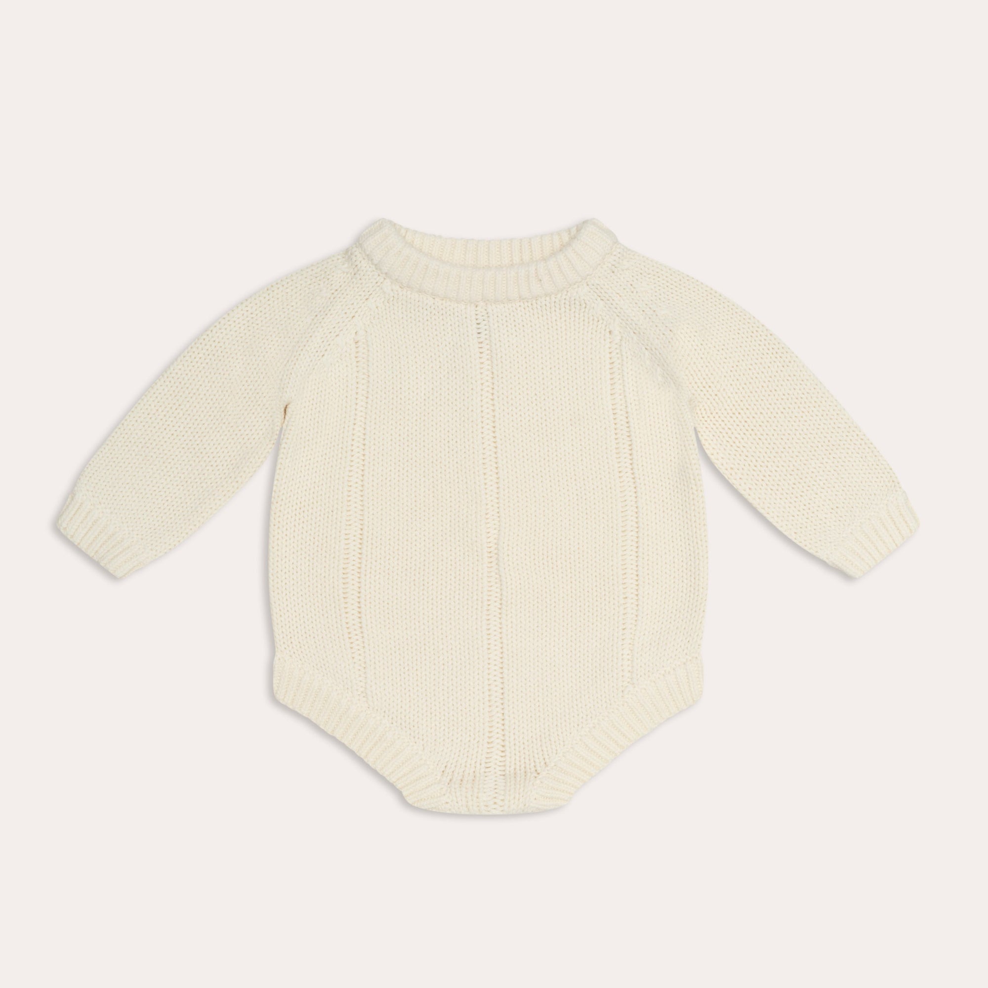 An illoura tallow knit romper | vanilla from Illoura the Label for a baby's knitted bodysuit in cream.