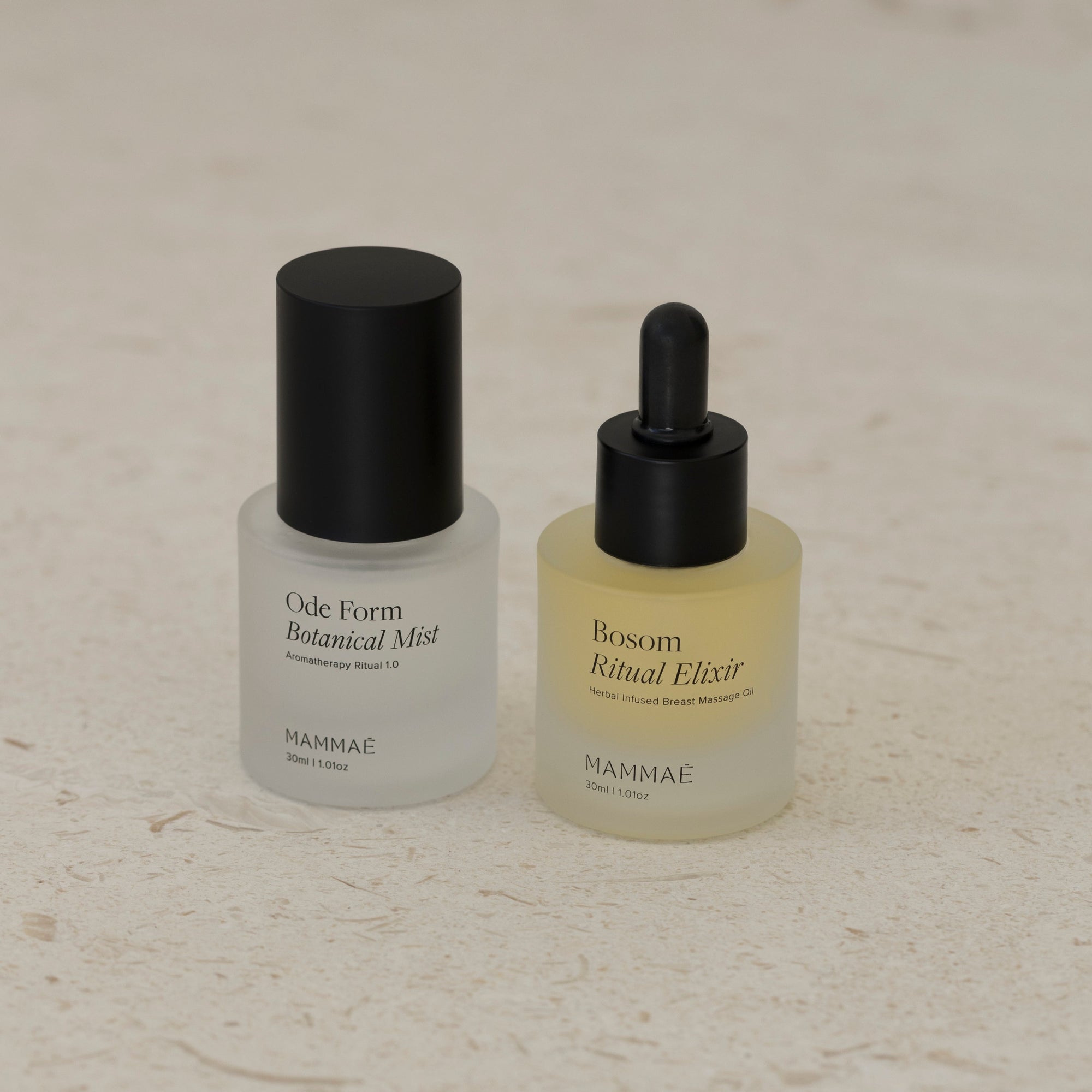 An EXCLUSIVE mini ritual duo bundle from Mammae - a bottle of facial oil gracefully placed on a pristine white surface.