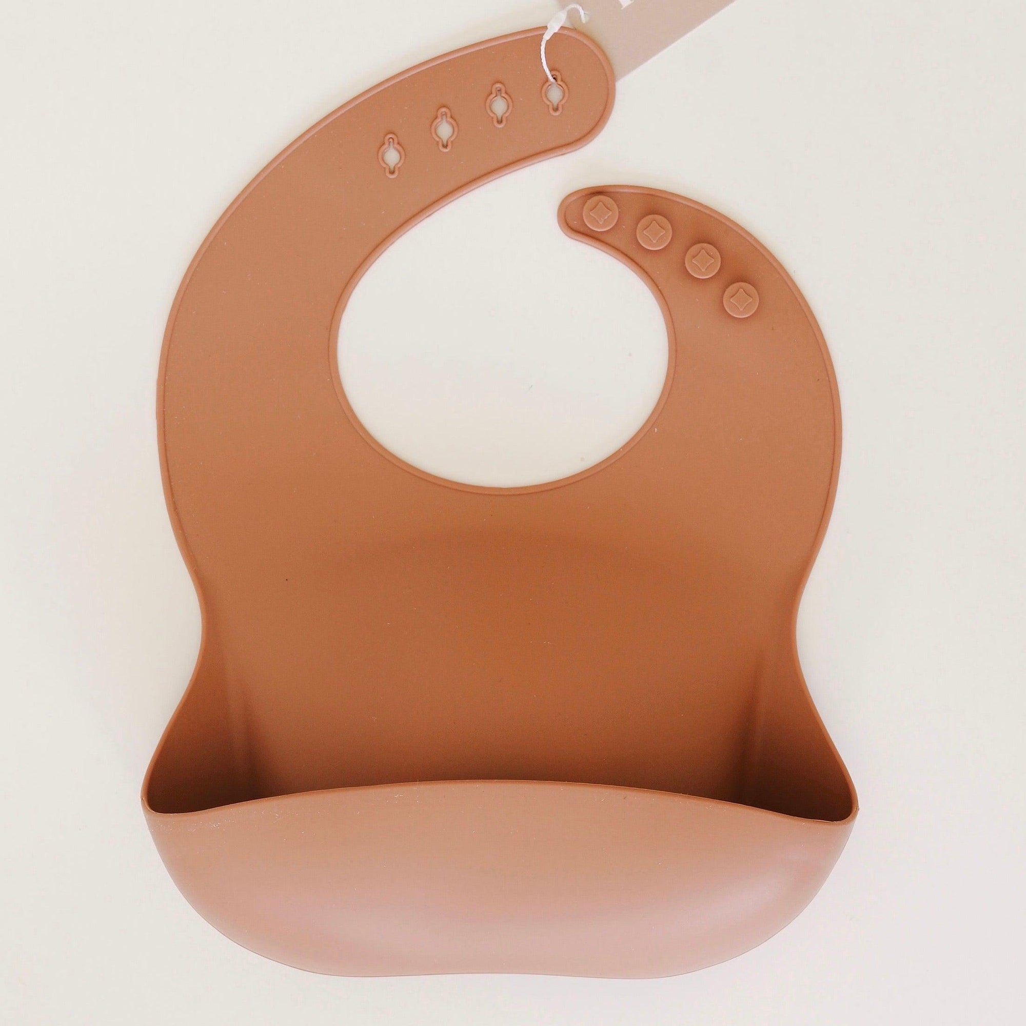 Rommer bibs are made from the softest silicone. They are both lightweight and durable. Rommer has updated the bib design to feature the reinforced button holes making them more resistant to tears.