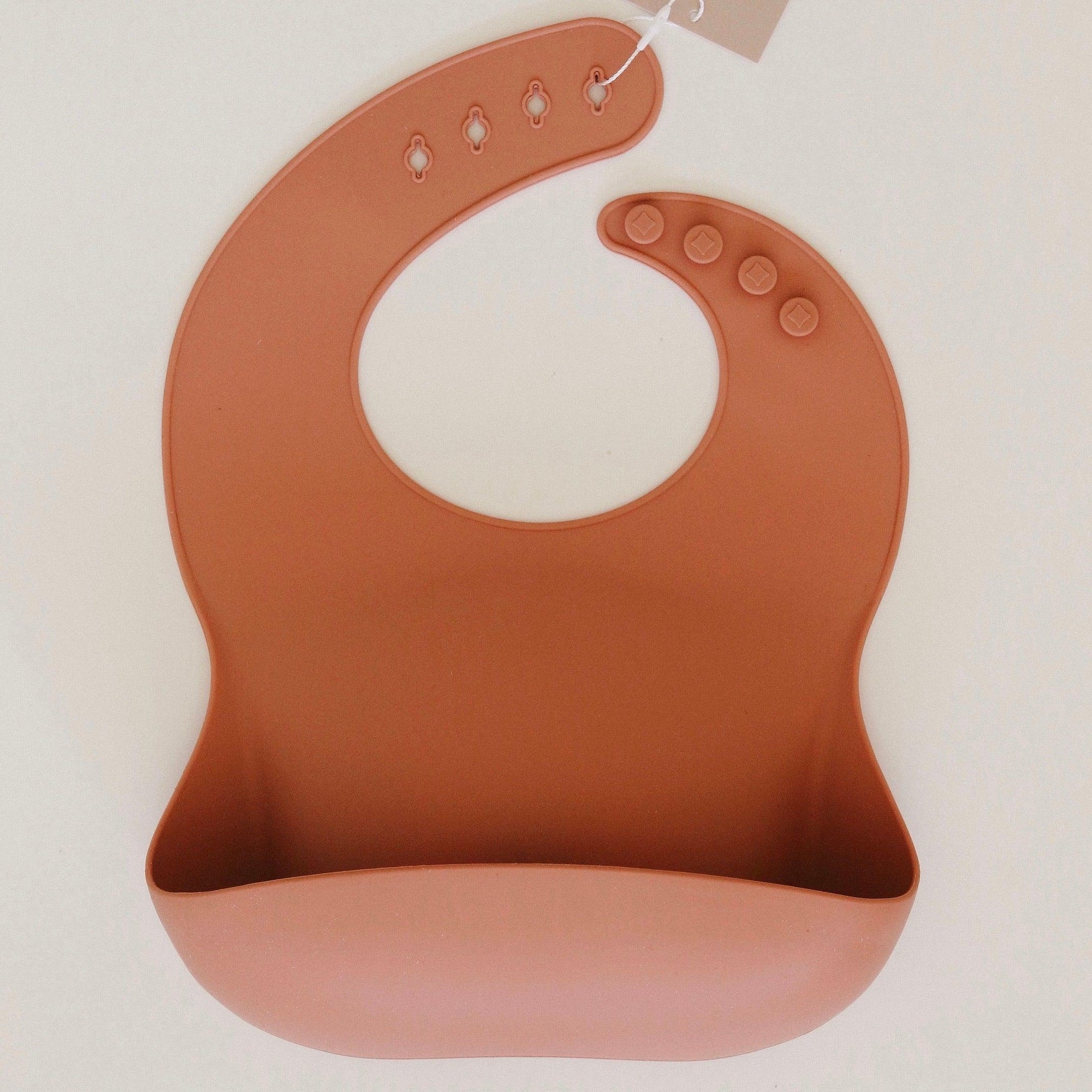 Rommer bibs are made from the softest silicone. They are both lightweight and durable. Rommer has updated the bib design to feature the reinforced button holes making them more resistant to tears.